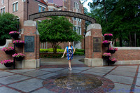 baduffy-260426-Tea's Grad Pics-6975-in UF arch dress and sash centered