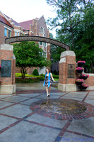 baduffy-260426-Tea's Grad Pics-6986-dress and sash stroll and laugh at arch