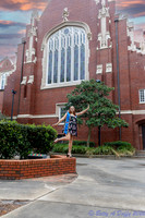 baduffy-260426-Tea's Grad Pics-7066-kick it out pose on a wall