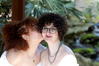 baduffy-260315-Tea & Taryn Engagement -5648-cheek kiss waterfall backdrop