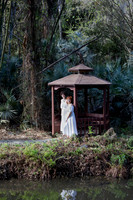 baduffy-260315-Tea & Taryn Engagement -5657-environmental with brown gazebo smiling